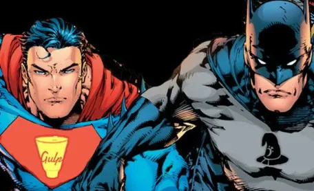 Comic showing Batman and Superman with a grim face looking into the camera. On Superman's Chest is a Gulp Logo while Batmans chest shows a witches hat